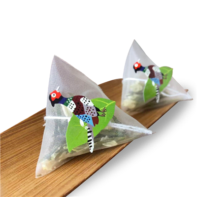 Rollo de bolsitas de té piramidal de nailon PA con etiqueta personalizada